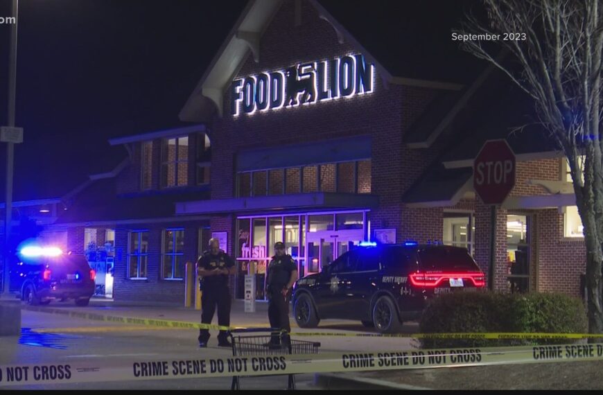 Police car outside a Food Lion store following a tragic shooting