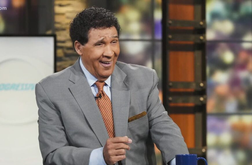 Greg Gumbel in a CBS Sports studio during a live broadcast