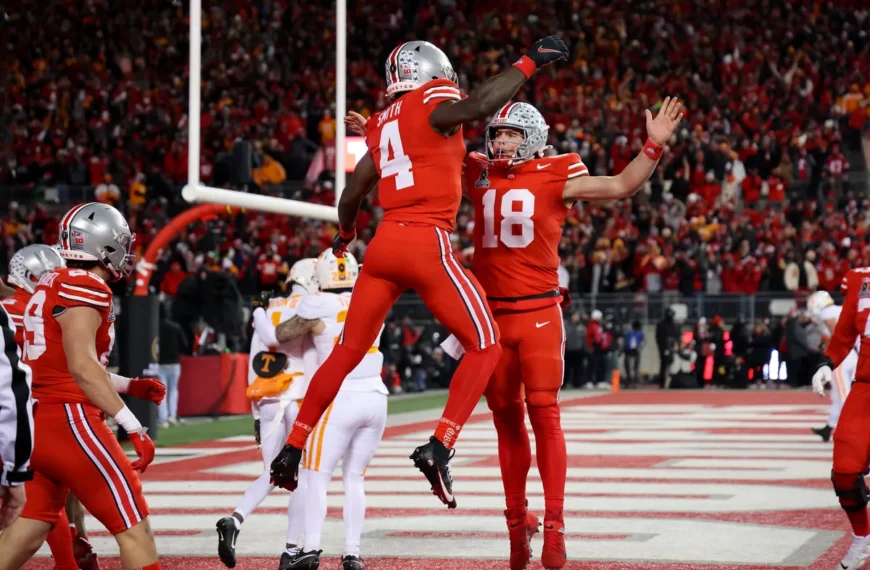 Ohio State players celebrating a decisive 42-17 victory over Tennessee in the CFP first round.