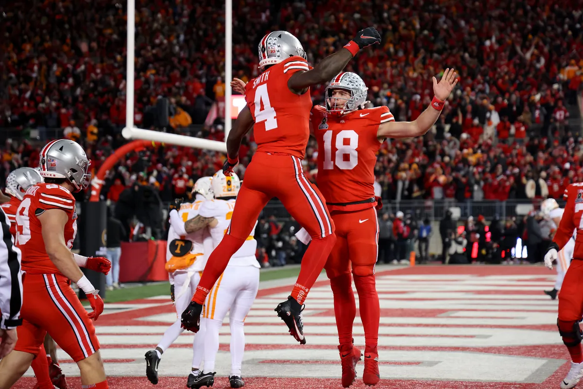 Ohio State players celebrating a decisive 42-17 victory over Tennessee in the CFP first round.