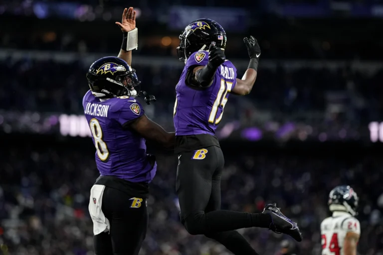 Lamar Jackson celebrating a touchdown during the AFC Divisional Playoff game against the Houston Texans.