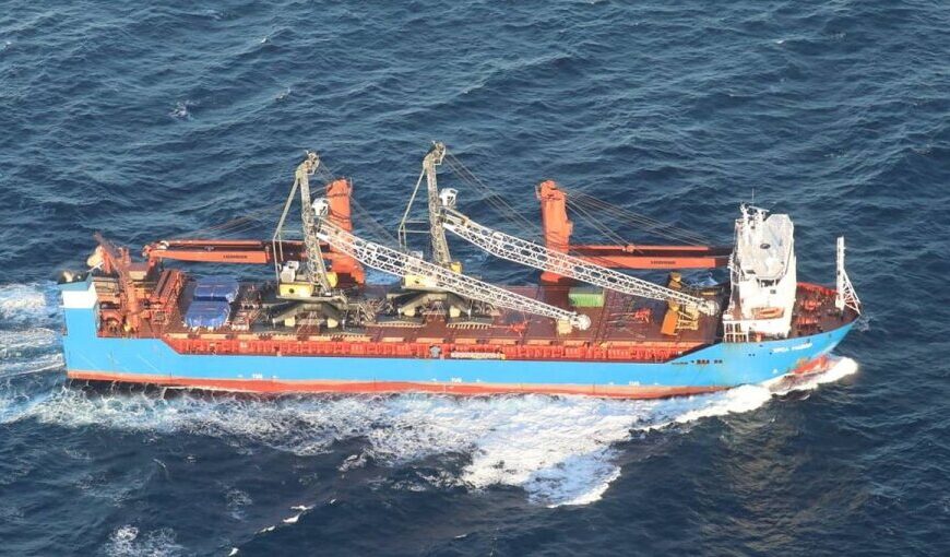 A sinking cargo ship in the Mediterranean Sea with rescue operations underway