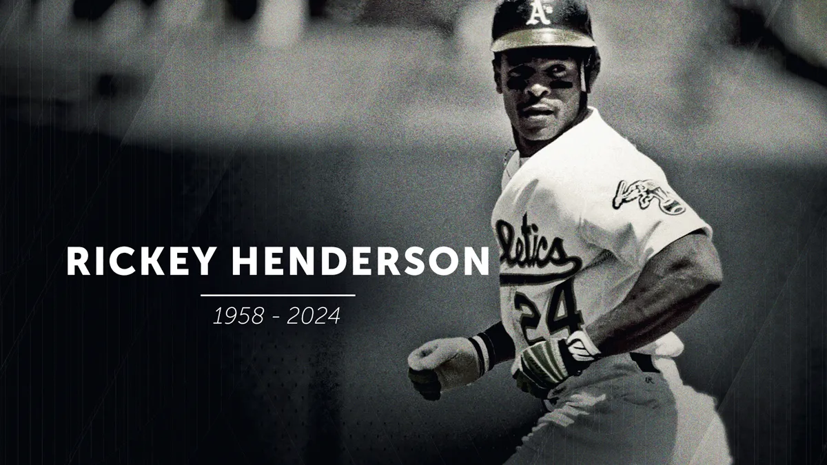 Rickey Henderson celebrates during a game, embodying his legacy.