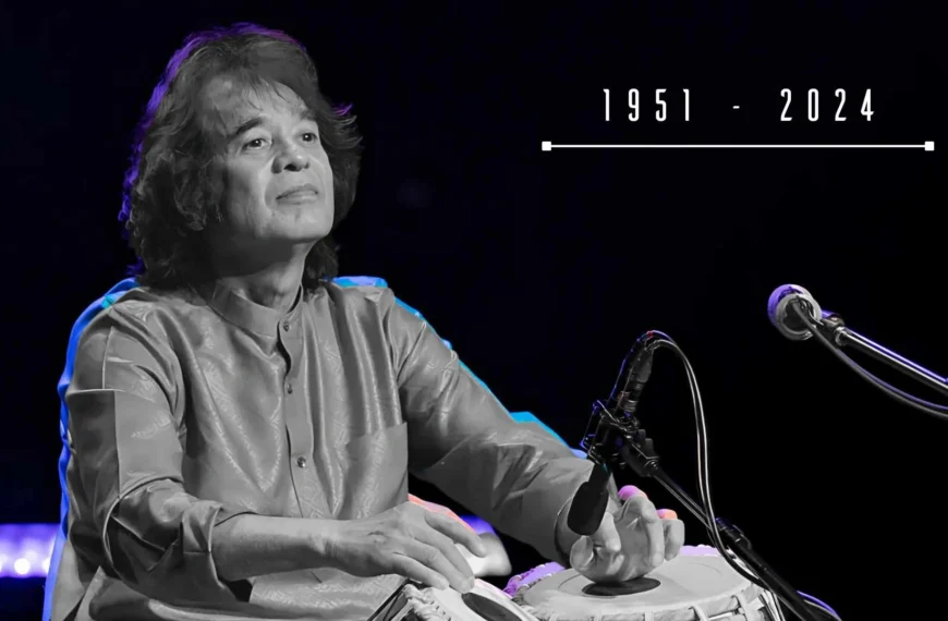 Legendary tabla maestro Zakir Hussain performing on stage.