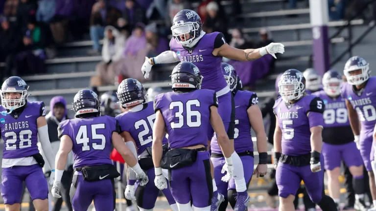 Mount Union players celebrate after defeating Johns Hopkins to clinch a Stagg Bowl berth.