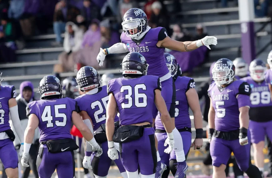 Mount Union players celebrate after defeating Johns Hopkins to clinch a Stagg Bowl berth.