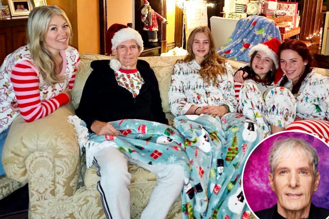 Michael Bolton smiling with family in a heartfelt Christmas photo during his recovery from a brain tumor