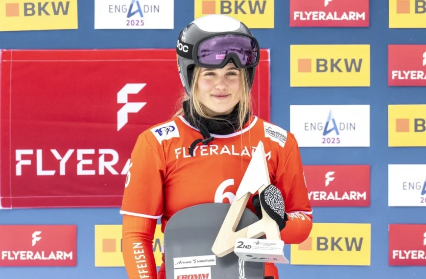 Swiss Olympic snowboarder Sophie Hediger, smiling in her snowboarding gear, remembered for her achievements and tragic passing at 26.