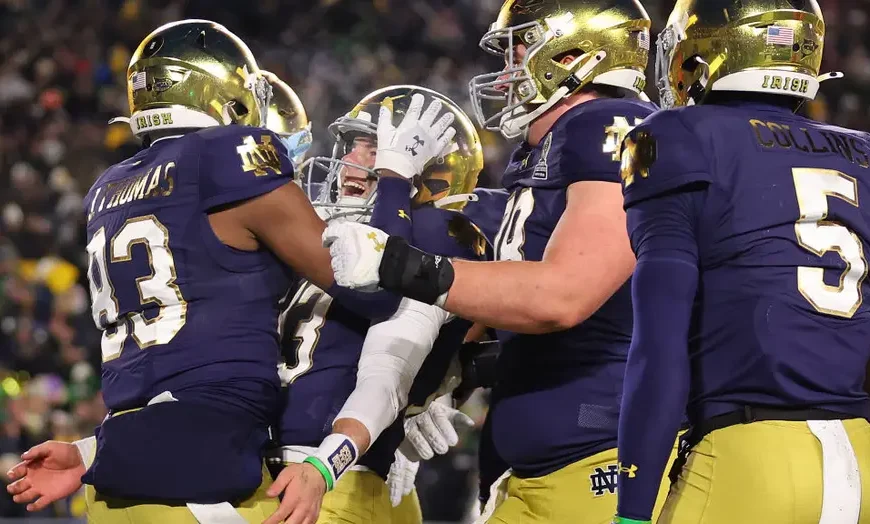 Notre Dame players celebrating their 27-17 victory over Indiana in the College Football Playoff