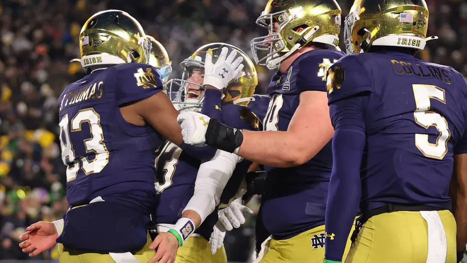 Notre Dame players celebrating their 27-17 victory over Indiana in the College Football Playoff