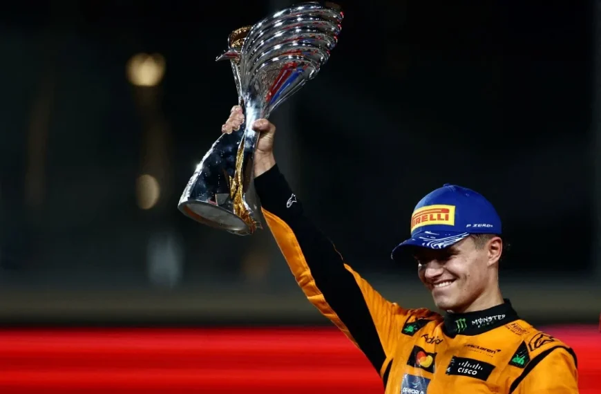 Lando Norris celebrates victory at the 2024 Abu Dhabi Grand Prix, driving his McLaren to secure the team's first Constructors' Championship title since 1998