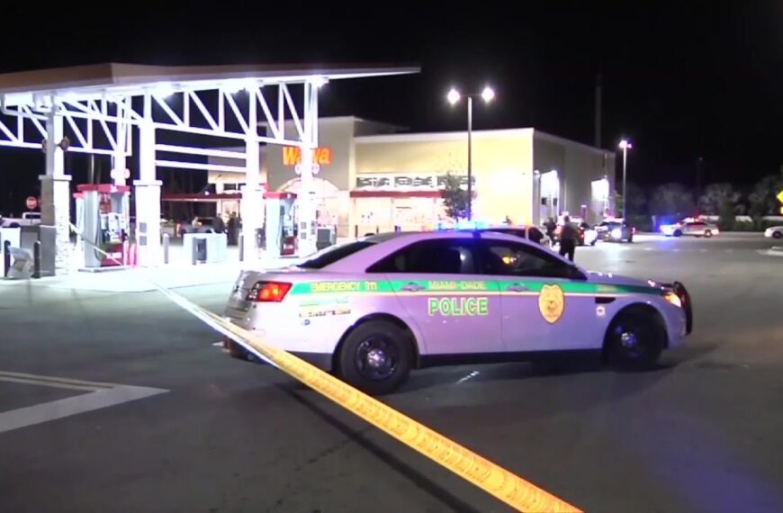 Police cars and caution tape outside a Wawa gas station in Miami-Dade after a tragic shooting left one dead and another injured