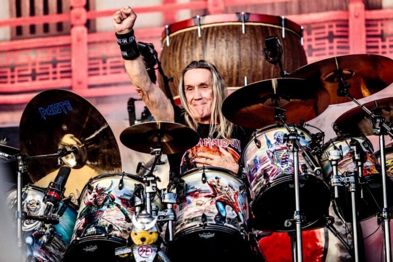 Nicko McBrain, Iron Maiden's iconic drummer, performing live on stage