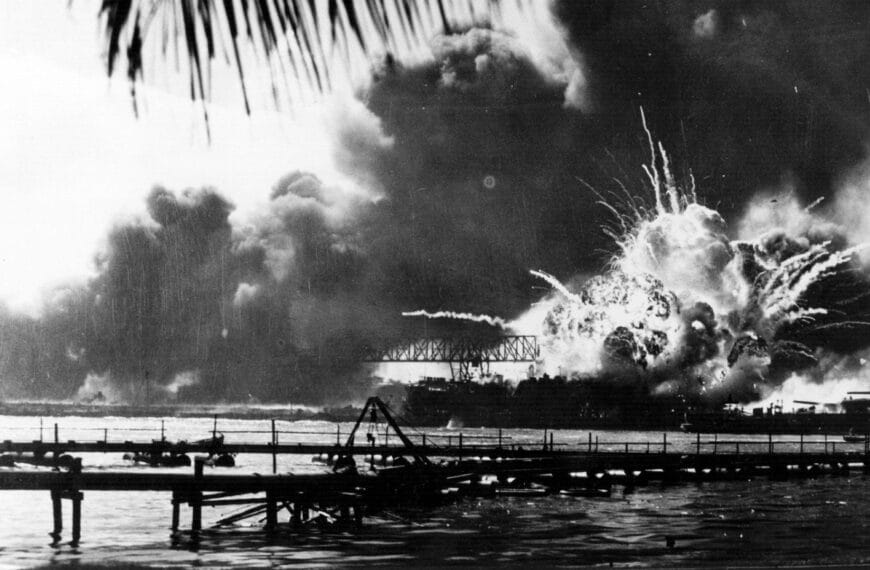 Pearl Harbor, stands in front of the USS Arizona Memorial, commemorating the 83rd anniversary of the attack on Pearl Harbor.